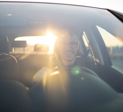 Zipper - happy-man-in-a-car-front-side