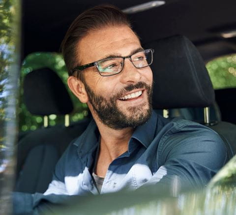 zipper-man-smiling-sitting-inside-a-car
