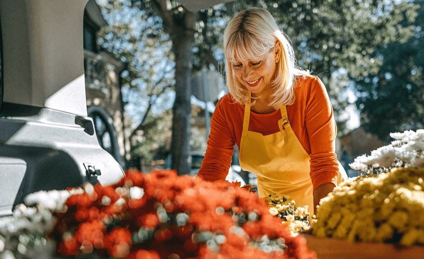 banner-lady-picking-up-flowers-from-lcv