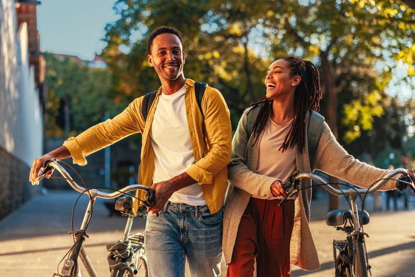 Laughing couple with bikes