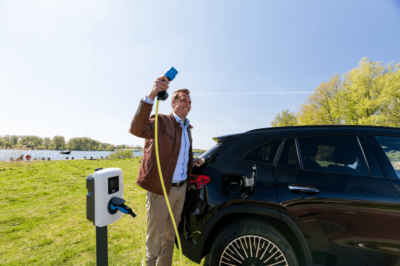 Man charging ev smile